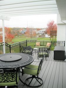 Westbury Aluminum railing on a back deck with patio furniture.