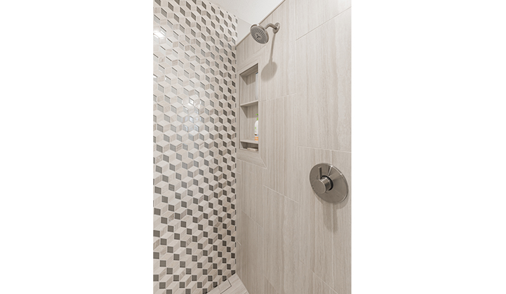 Upright shower with geometric tile work