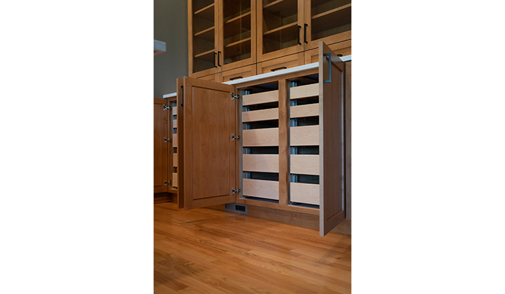 Large floor to ceiling cabinets that open to pull out shelves