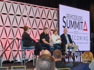 Willet Construction at remodelers summit, four panelists sitting on chairs on a stage.