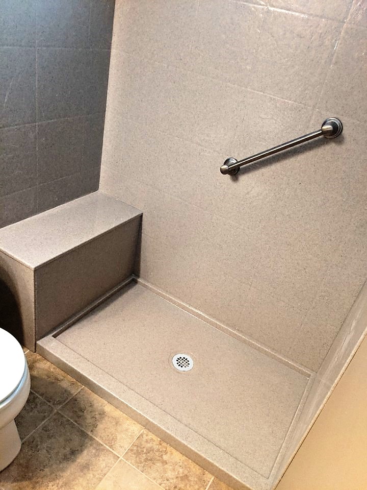 Walk-in shower installed in a small bathroom.