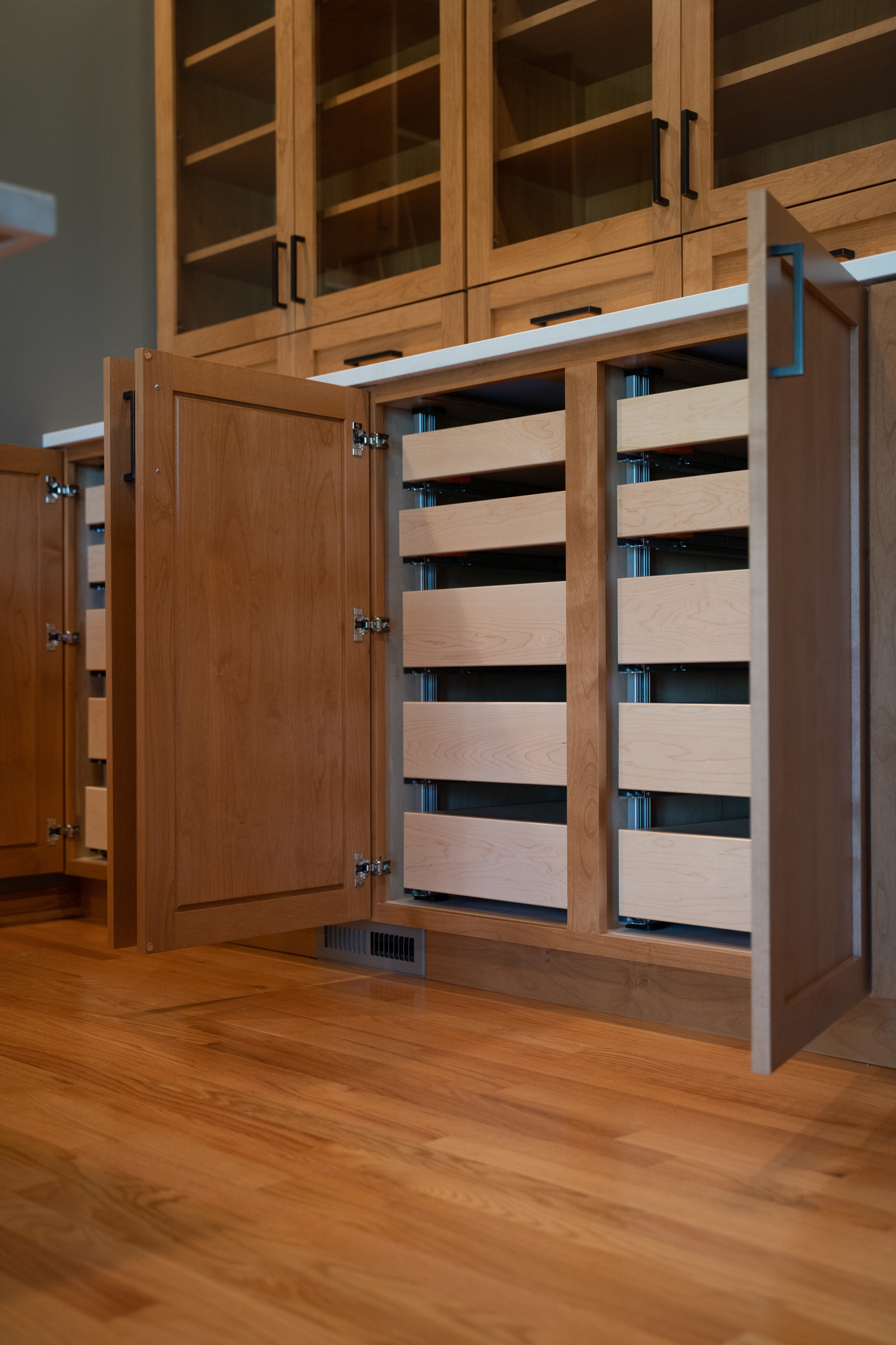 Large floor to ceiling cabinets that open to pull out shelves