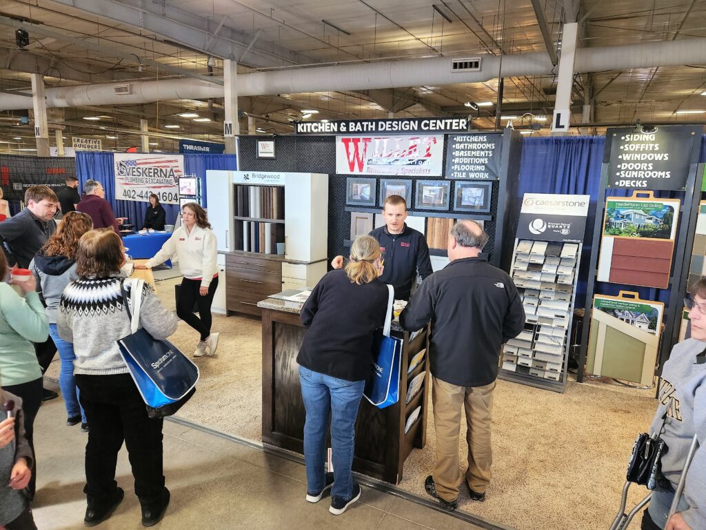 Nebraska Builders Home & Garden Show Willet Construction booth with various people visiting