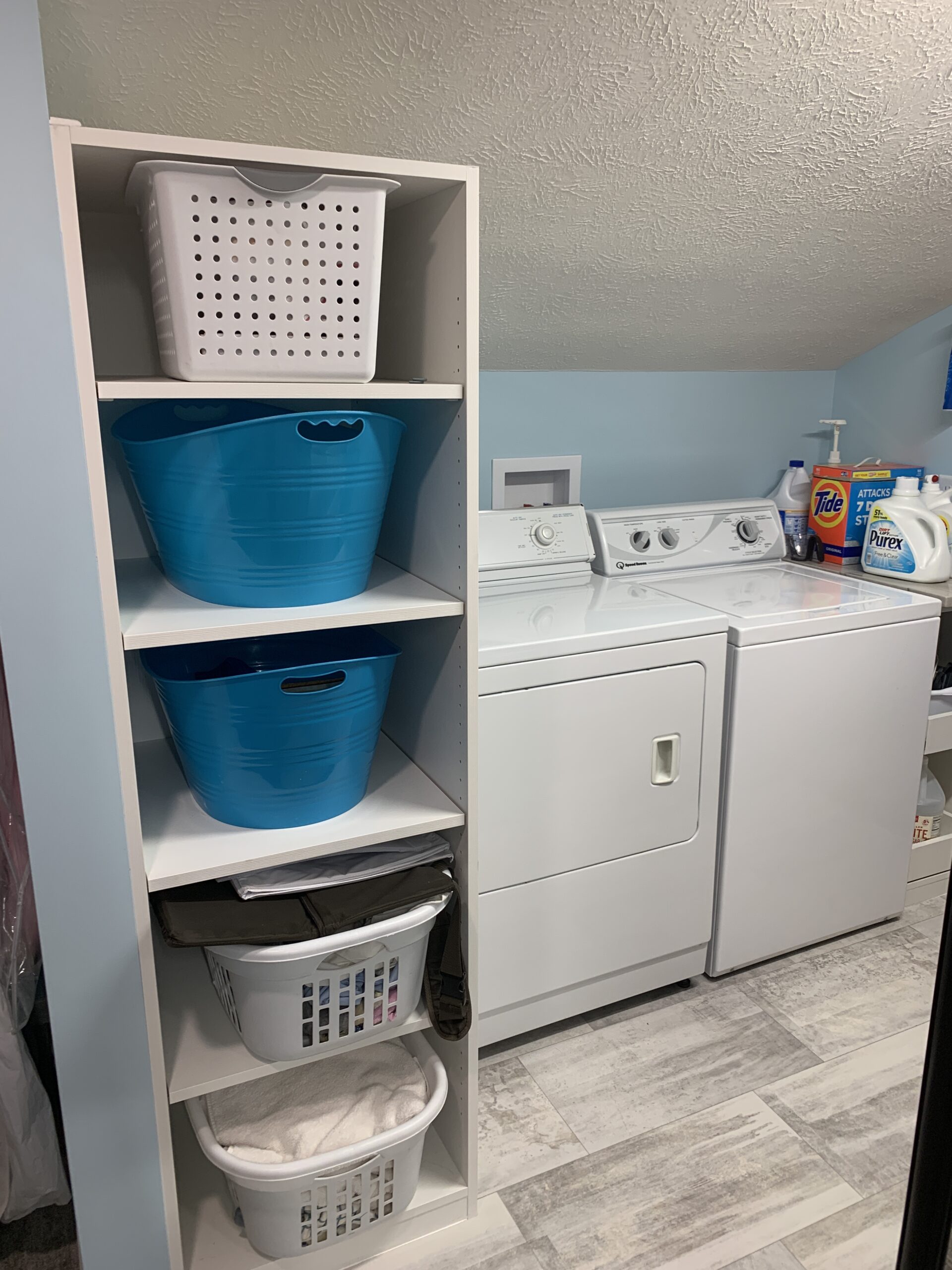 Laundry room with blue walls
