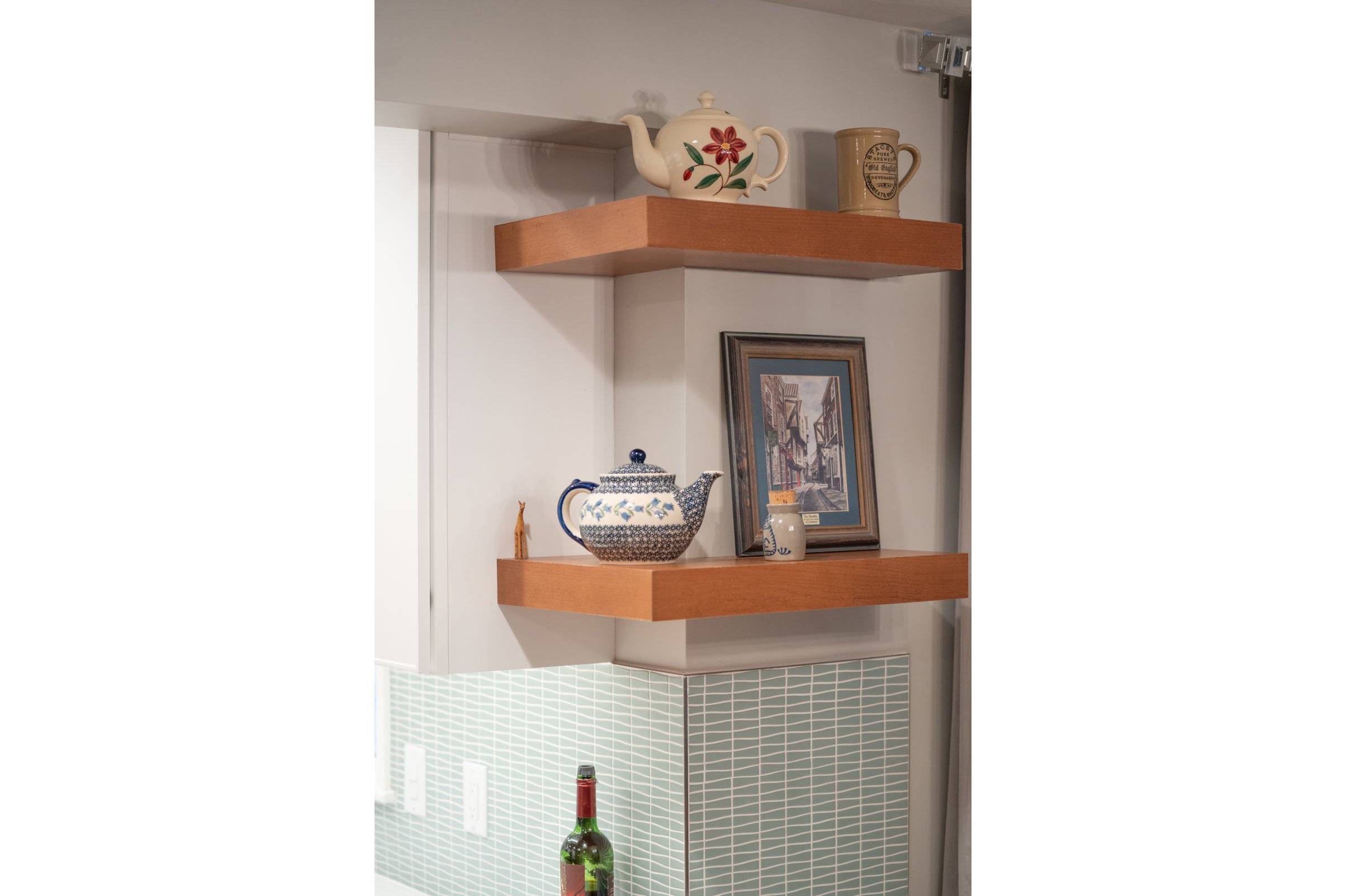 Floating shelves with teapots on them