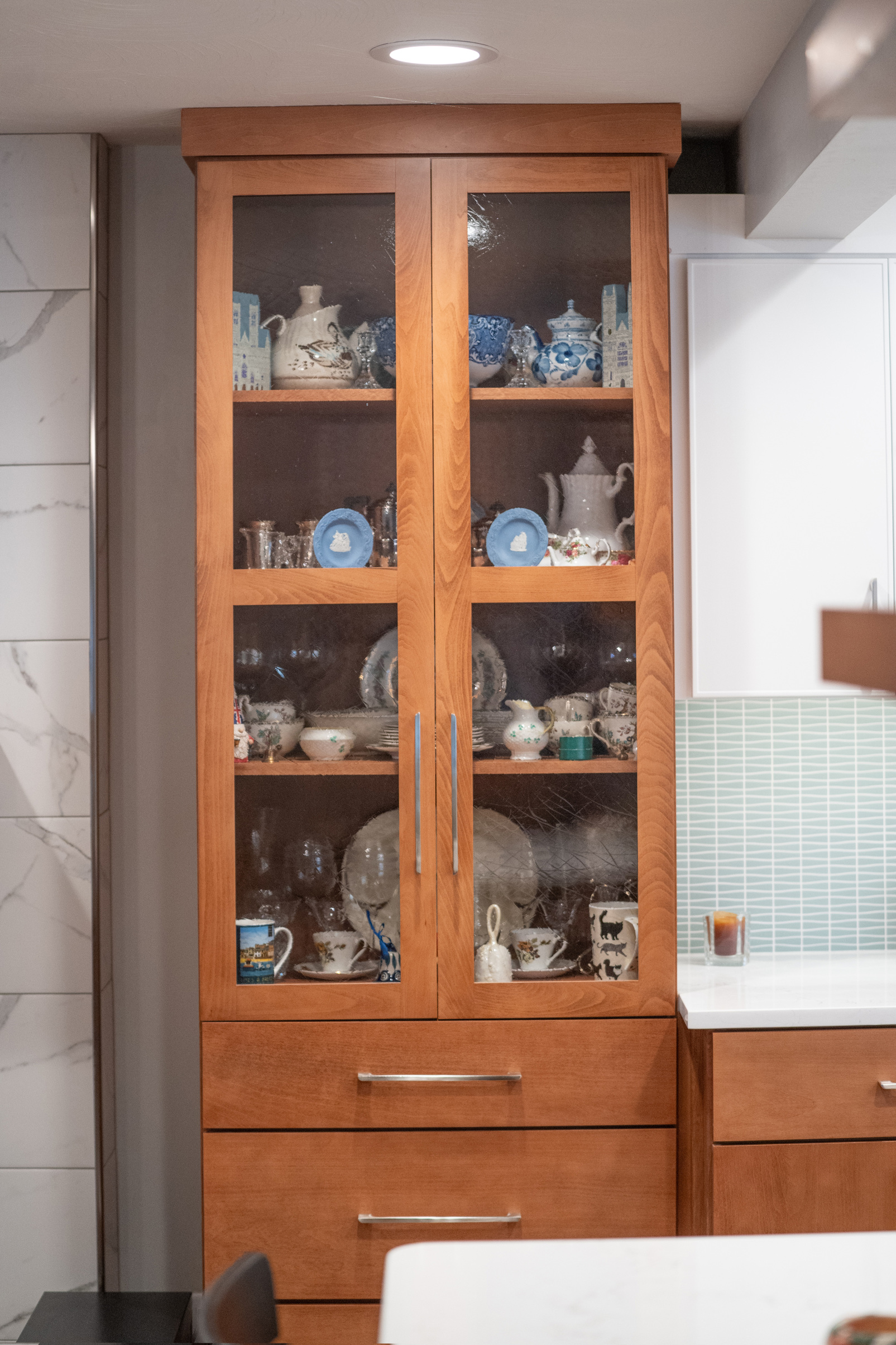 A new wooden china cabinet with drawers