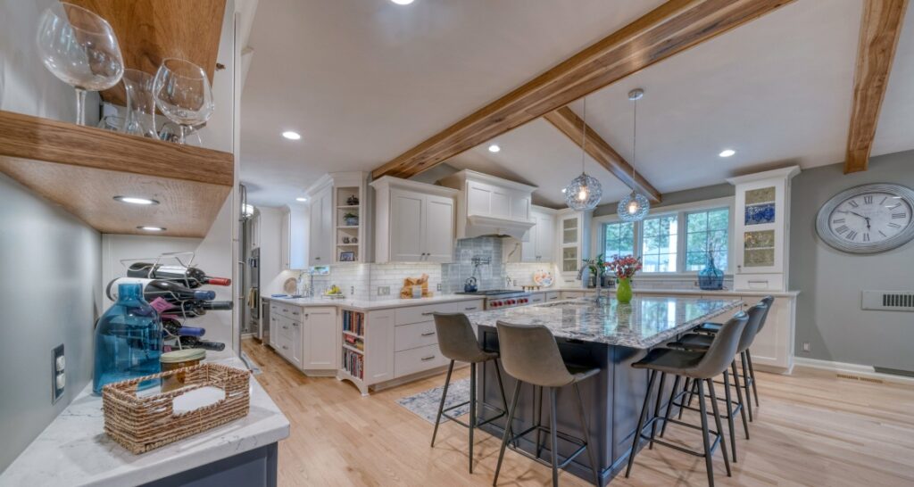Remodeled kitchen with wood ceiling beams and large island
