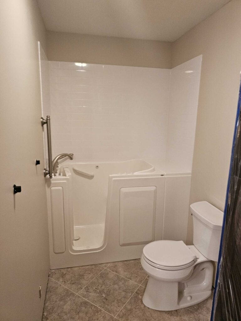 "After" image of updated walk-in shower for accessibility.