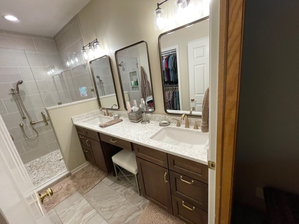 After image of updated bathroom with standing shower and double vanity.