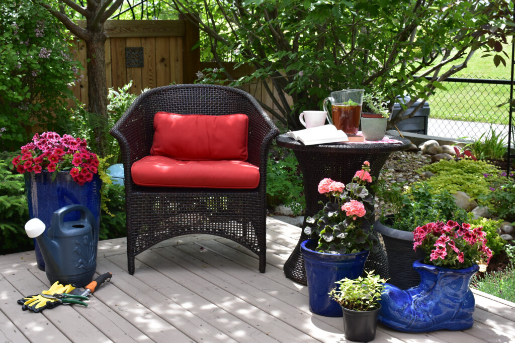 deck image with bold red chairs and blue planters