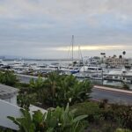 A view of sunset, with boats in the distance at a dock, in San Diego. This is where the Remodeler’s Advantage Summit was located.