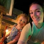 A woman and child are smiling. The Home Builders Association of Lincoln (HBAL) treated members and their families to a night at Roca Berry Farm.