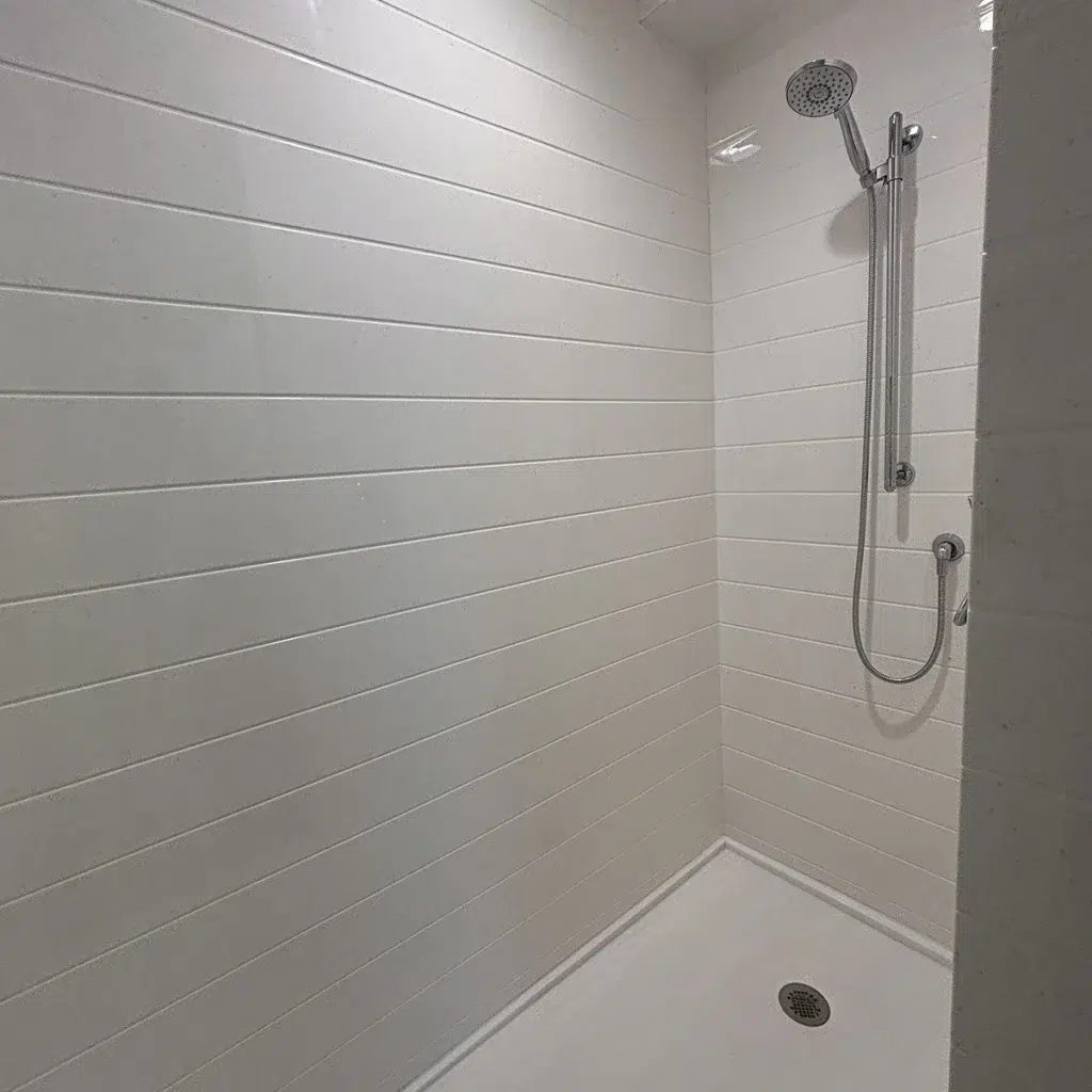 walk-in shower installed in a basement in-law suite