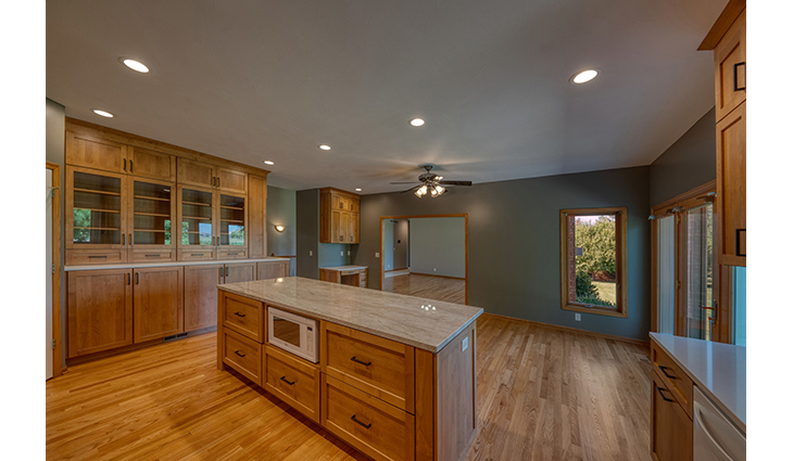 Remodeled bathroom with stand-up shower and separate tub.